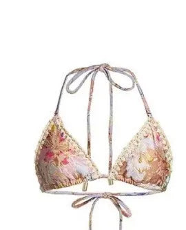 Women's floral bikini swimsuit set with skirt in creamy-white colour, showing top, briefs, and cover-up components