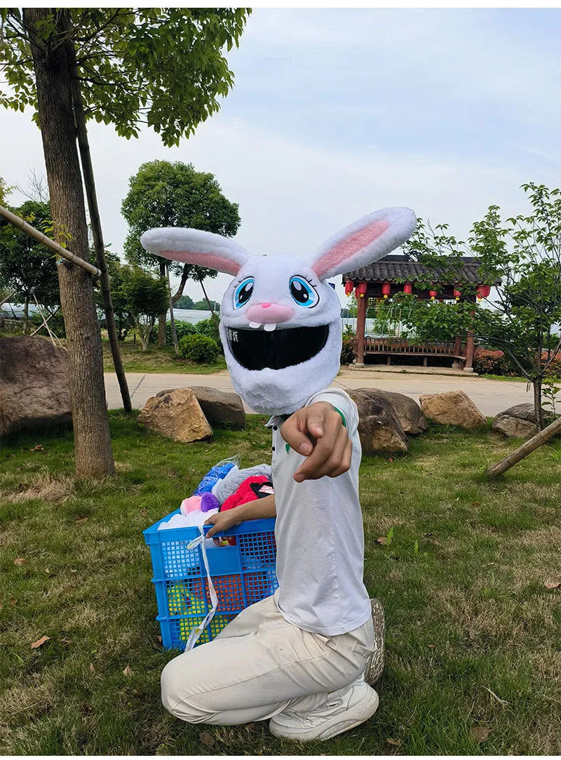 White plush rabbit head decorative cover on a motorcycle helmet for electric scooter commuting