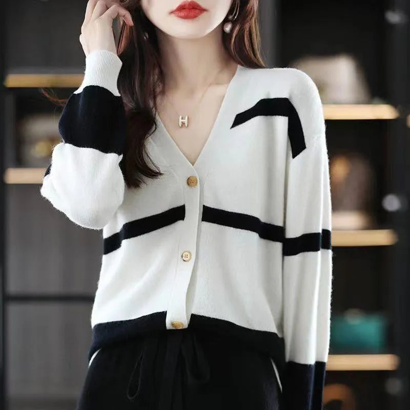 Women's striped V-neck knitted cardigan with 3D patterned sleeves and button front in a slim fit.