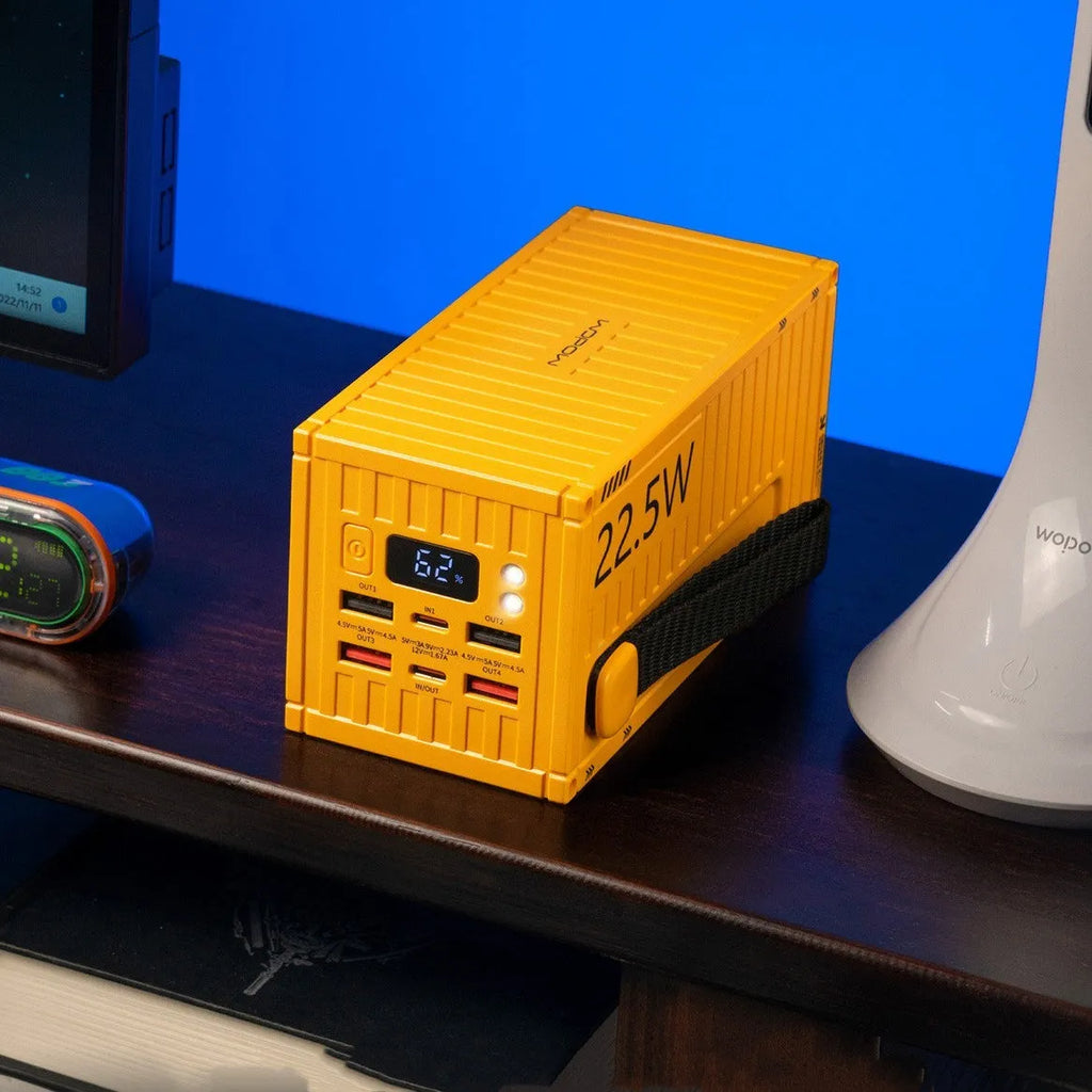 Yellow 50000mAh portable power bank with digital display screen and five USB output ports