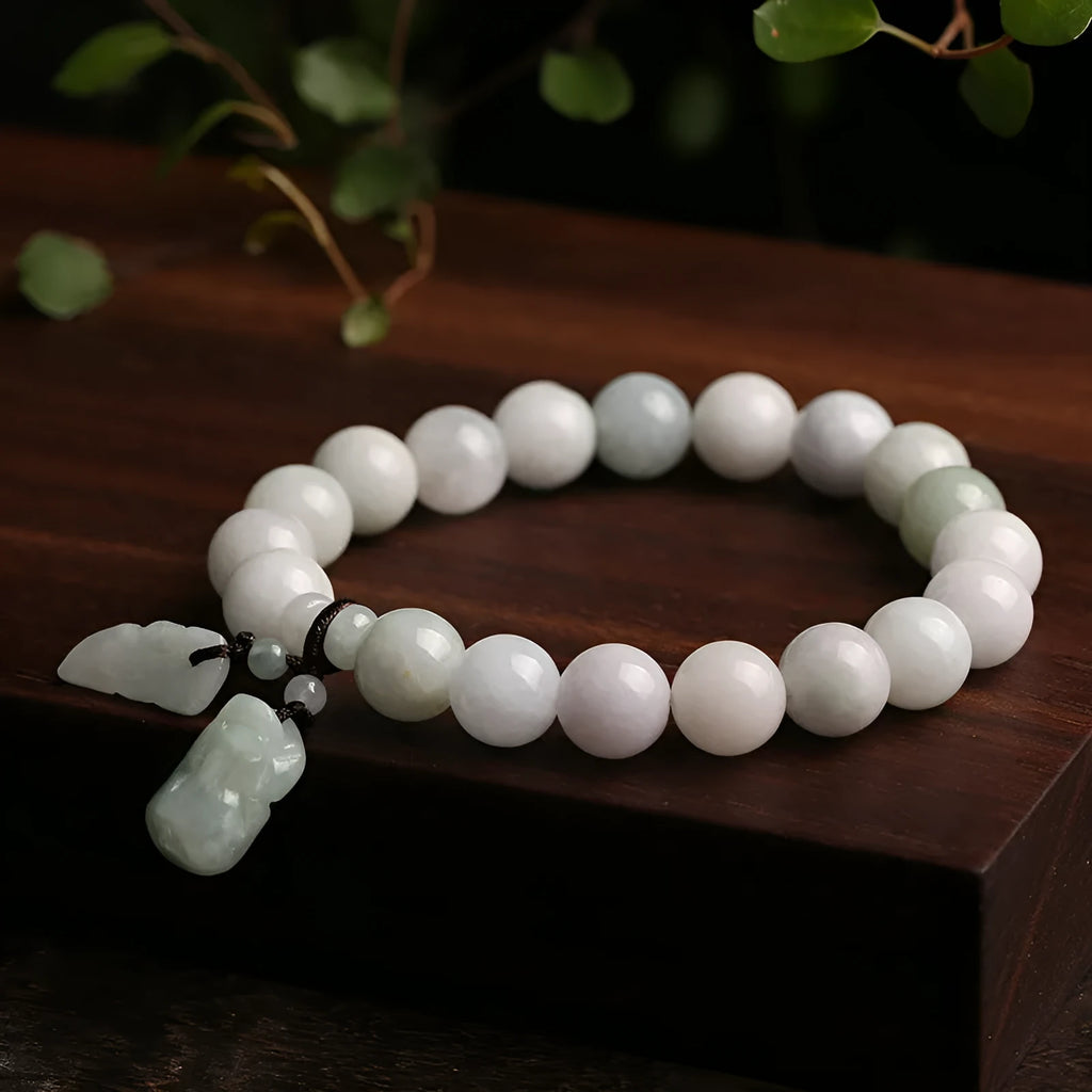 Natural jade Buddhist hanging bracelet showing geometric shape and symbolic charms