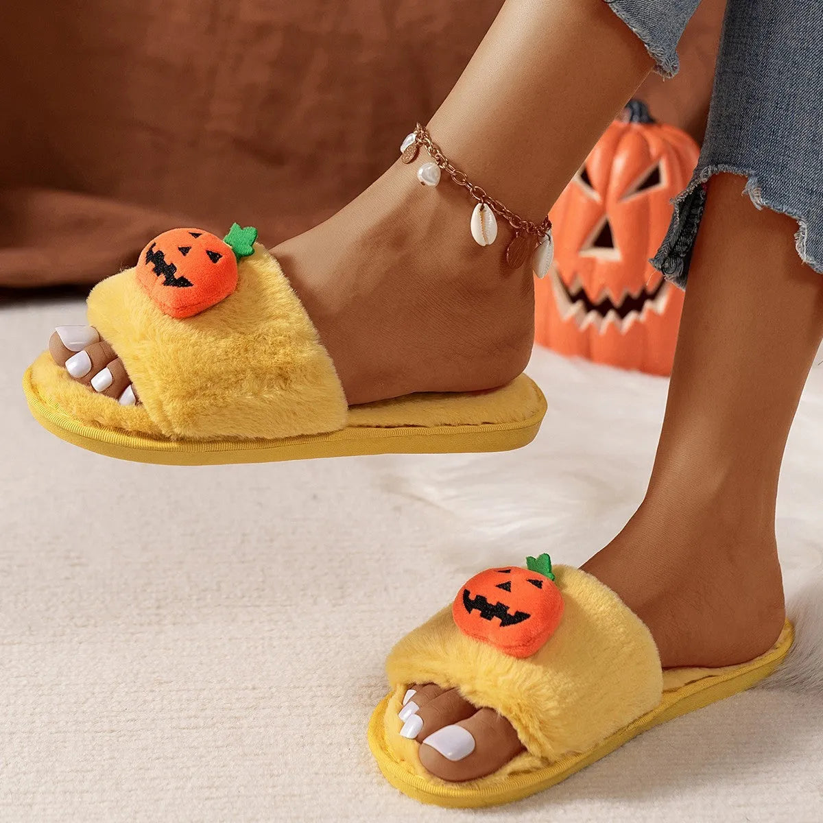 Yellow pumpkin cartoon design open-toe slippers with plush synthetic fur upper.