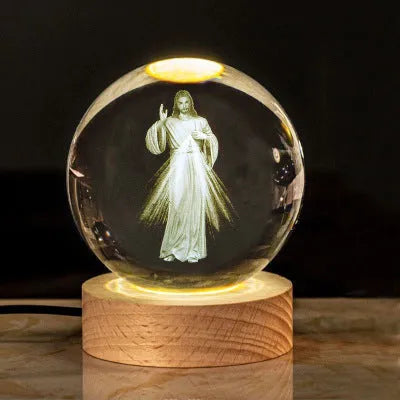 White crystal cross ornament with 6cm ball on wooden warm light base