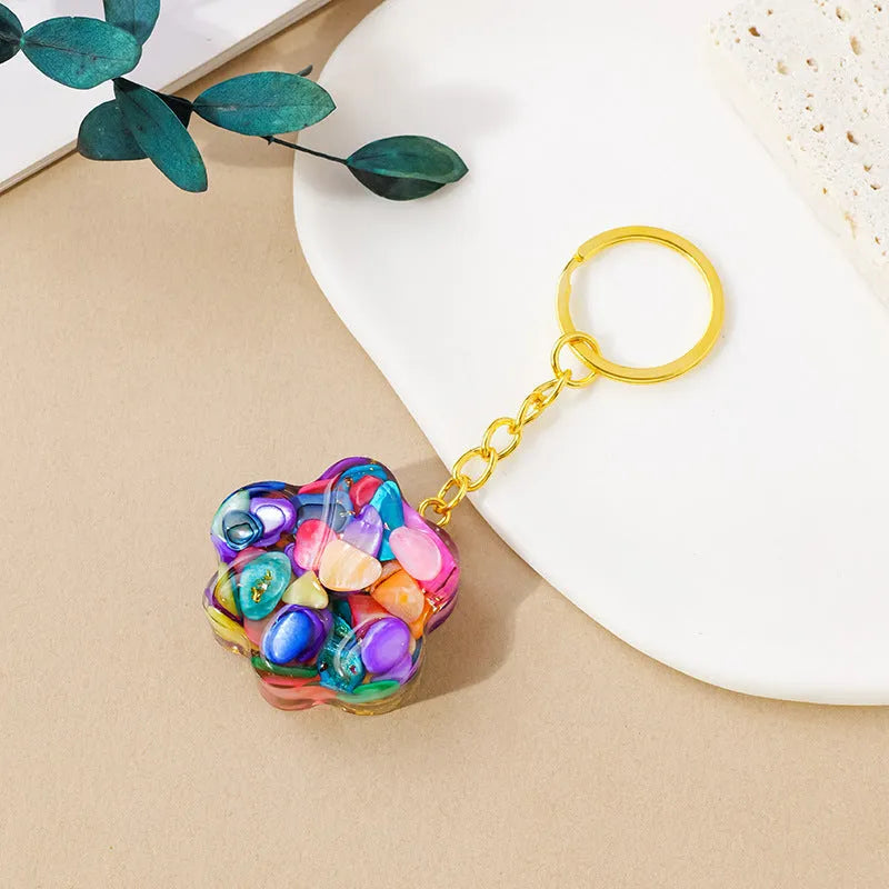 Small natural crystal cat's paw claw charm on a metal loop keychain