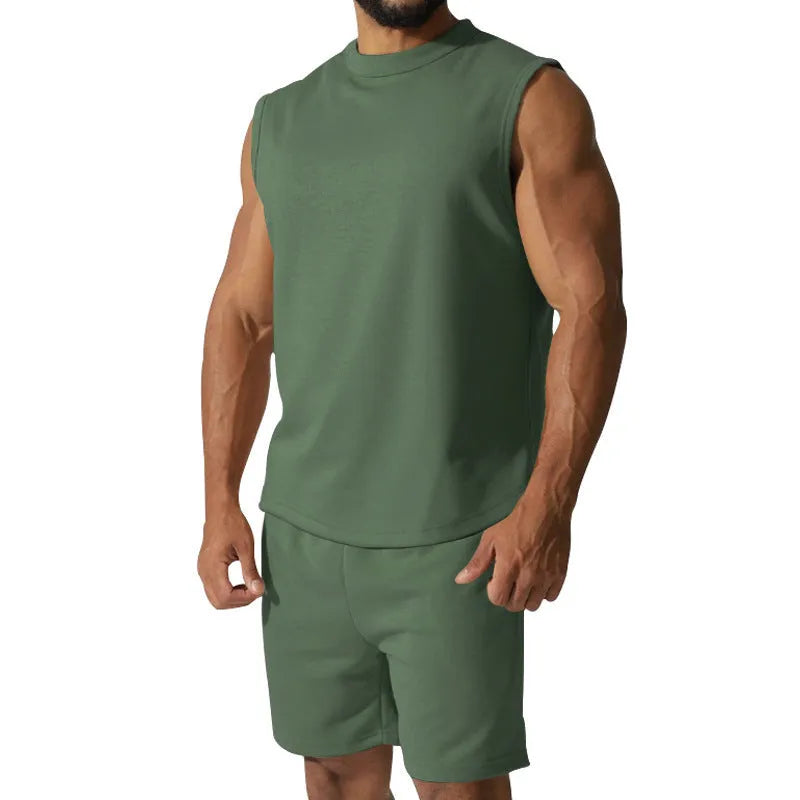 Men's sleeveless cotton blend sports suit showing sleeveless top and matching shorts in a solid colour.