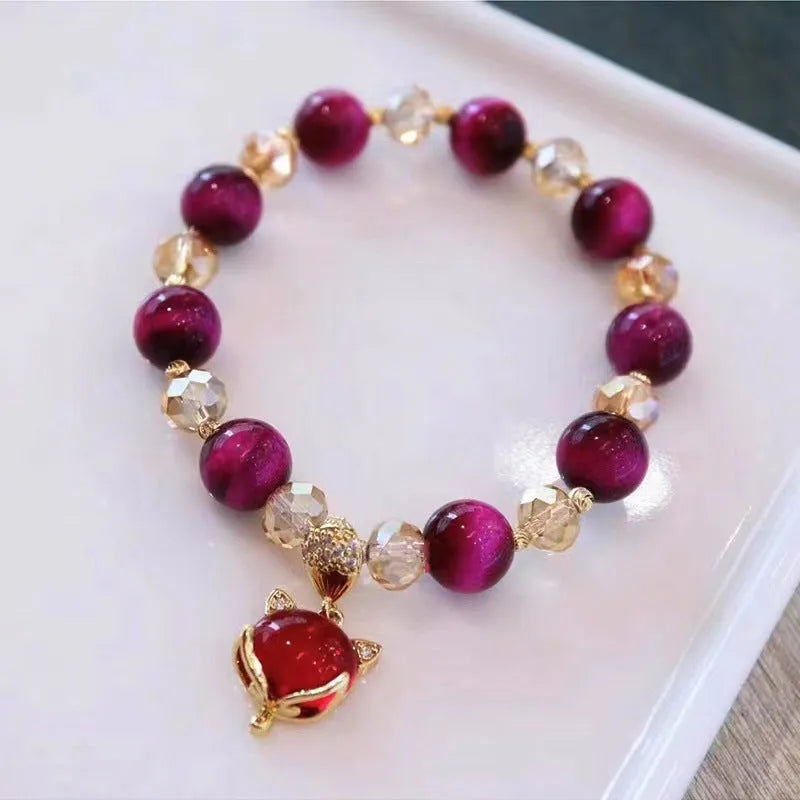 Handmade natural Vanves stone Tigereye bracelet on wrist showing single or double chain with fox motif.