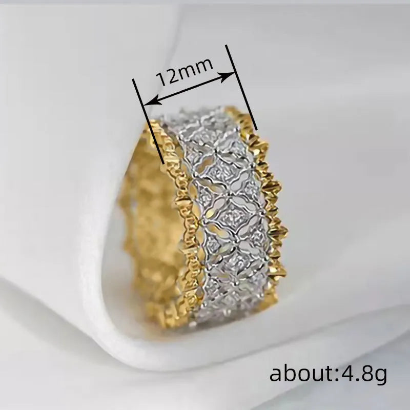 Geometric two-tone gold zircon ring on a copper band, showing round design elements.