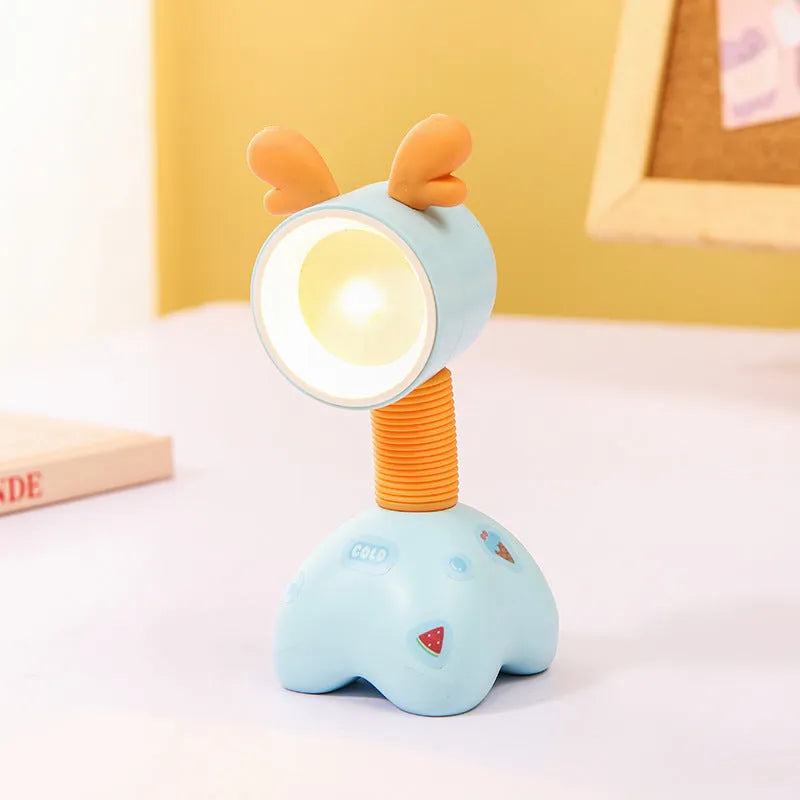 DIY cartoon animal small night lamp with magnetic base in assorted colours on a desk.