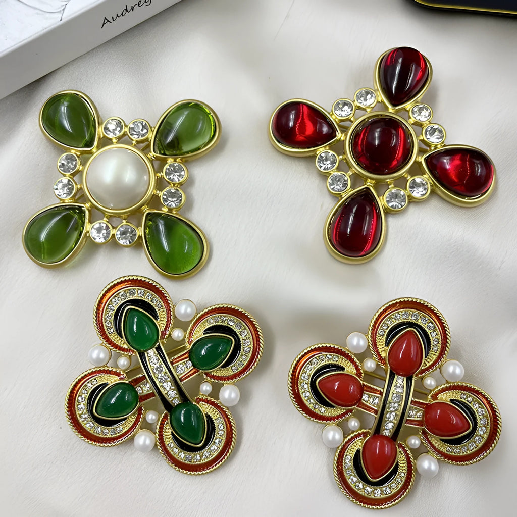 Close-up of a vintage medieval baroque cross brooch with crystals, made from zinc alloy.