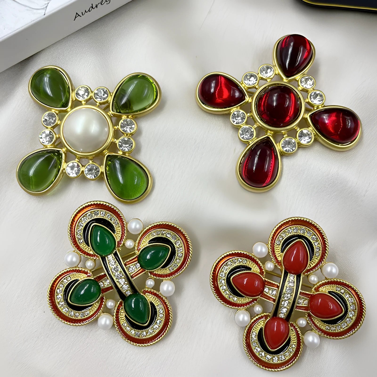 Close-up of a vintage medieval baroque cross brooch with crystals, made from zinc alloy.