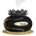 Pure black Lotus ultrasonic aromatherapy humidifier with USB cable and round design.