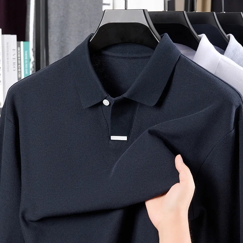 Men's loose-fit cotton polo shirt with lapel collar in grey, shown on a model.