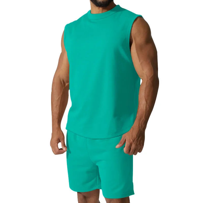Men's sleeveless cotton blend sports suit showing sleeveless top and matching shorts in a solid colour.
