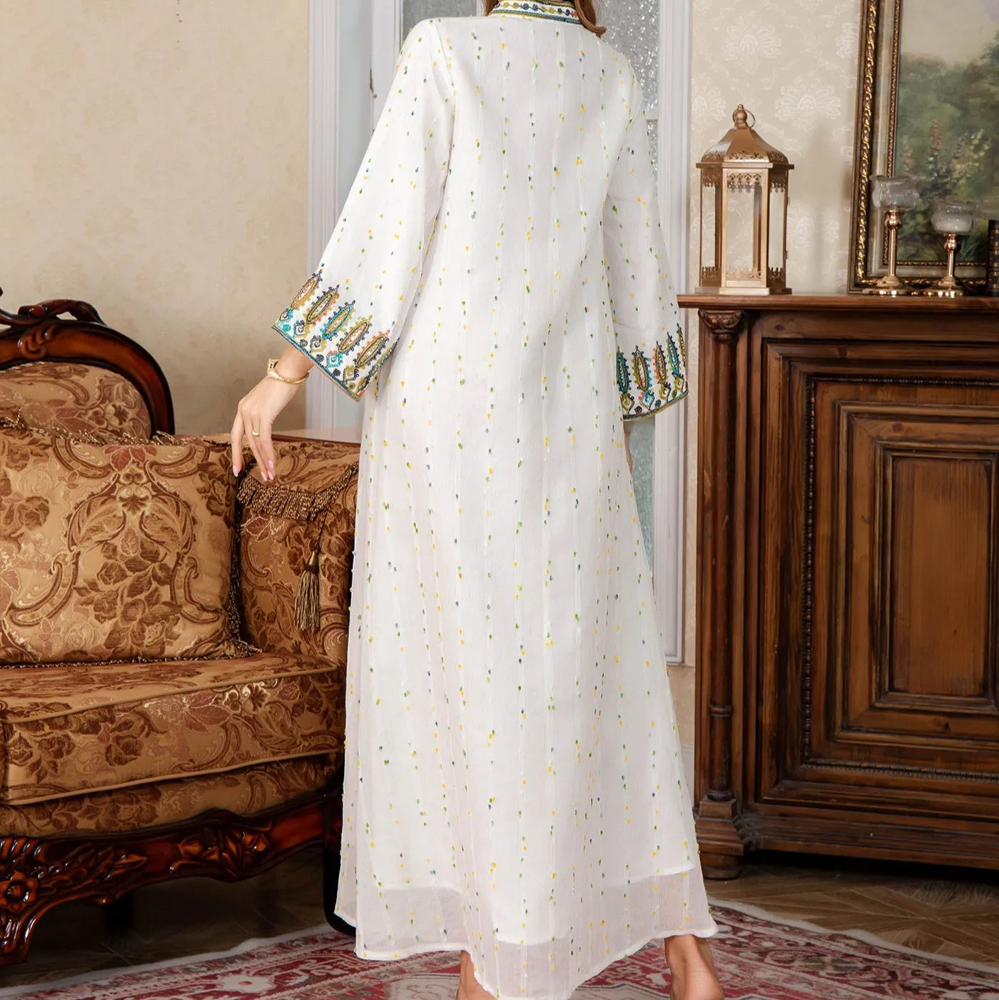 White traditional Dubai Arabic robe with long sleeves and floor-length design