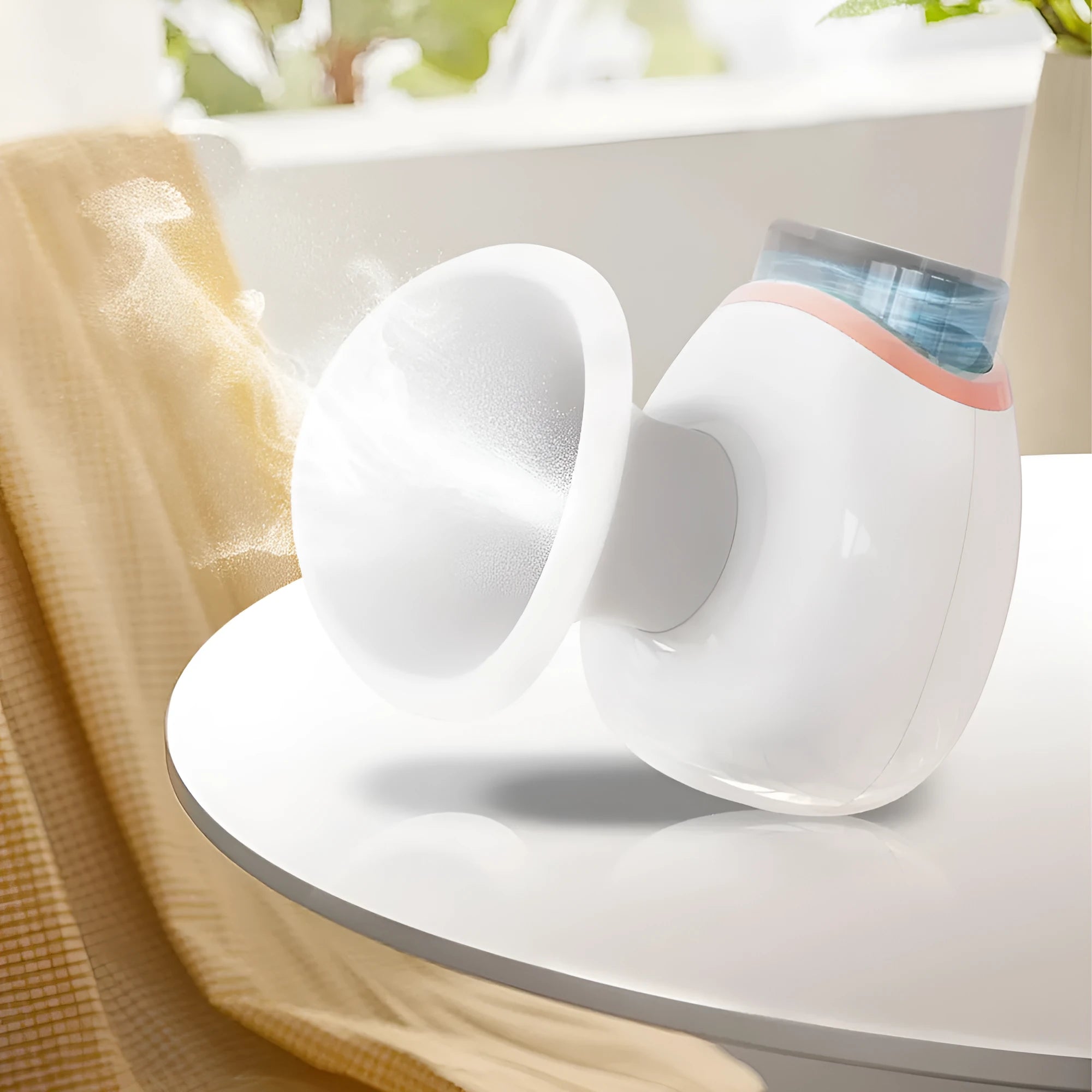 White and purple household eye humidifier with USB charging cable on wooden surface