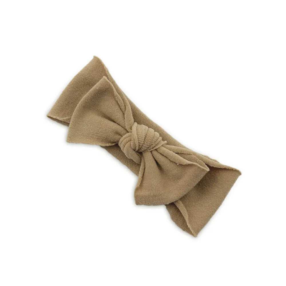 Solid colour knotted cloth headband for baby girls with bowknot design, available in 37 colours