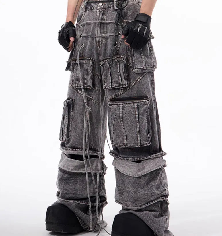 Grey distressed denim overalls with rope stitching detail on front