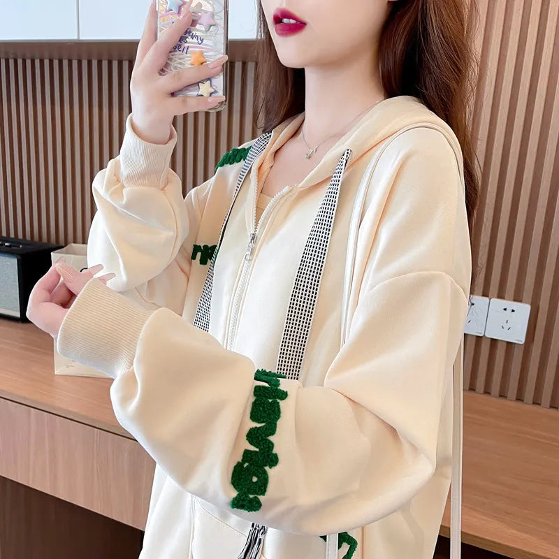 Loose large letter hooded cardigan coat for women in apricot with black lettering, long sleeves, and relaxed fit