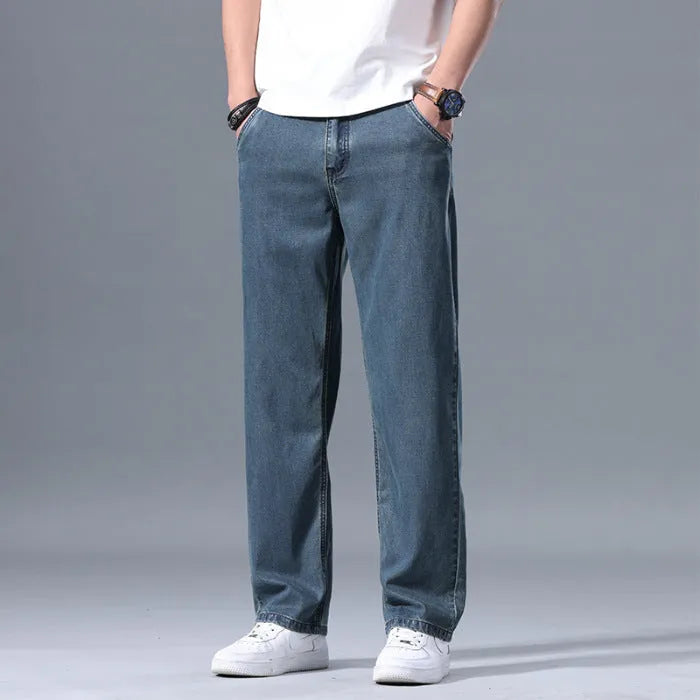 Men's loose straight-leg lyocell jeans in light blue, blue grey, smoky grey, and retro blue colours with zipper fly
