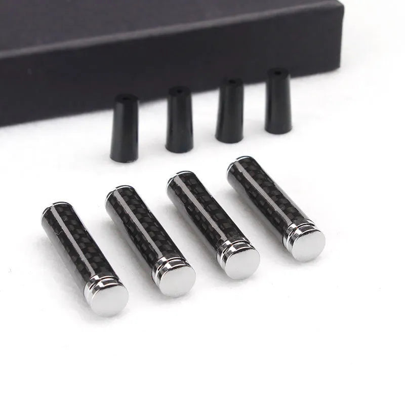 Set of four carbon fibre and metal composite car door lift covers for universal interior fitment.