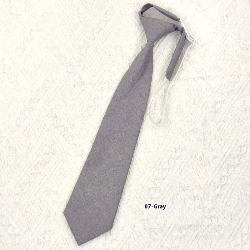 Men's navy blue cotton bow tie with arrow style on a plain background.