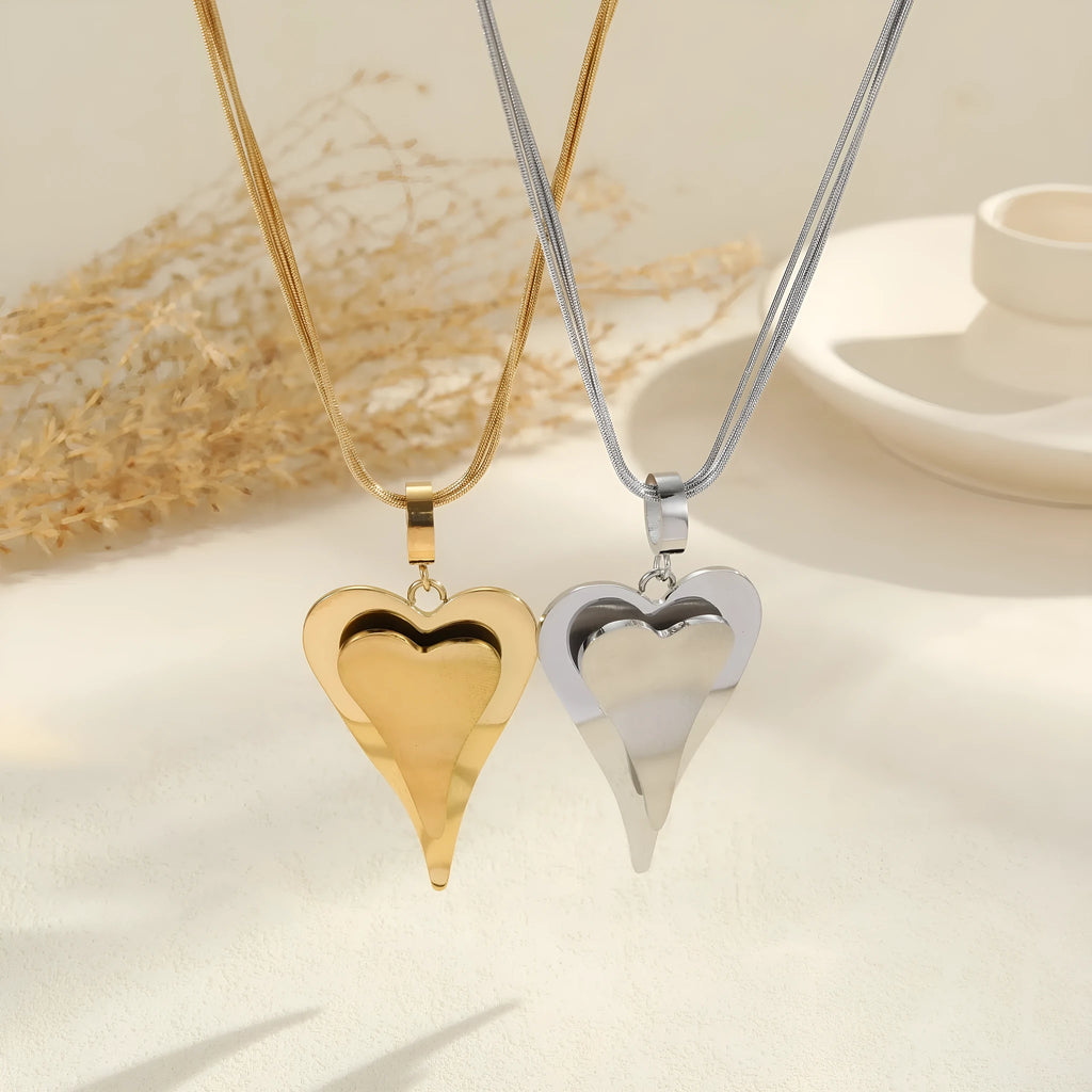 Geometric double heart pendant necklace with snake bones chain in stainless steel, gold tone and steel colour options