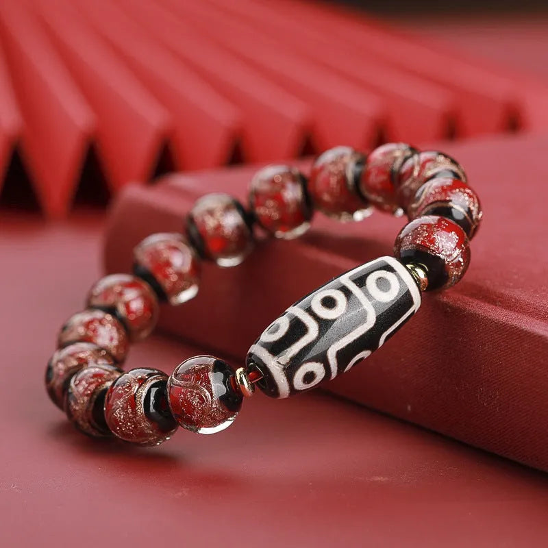Chinese-style coloured glaze lucky bead bracelet with auspicious patterns for the Year of the Snake.