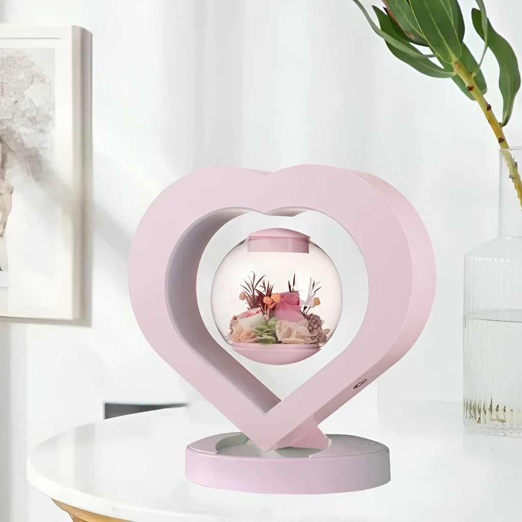 Pink preserved rose decorative ornament with optional Bluetooth-enabled base for playing music