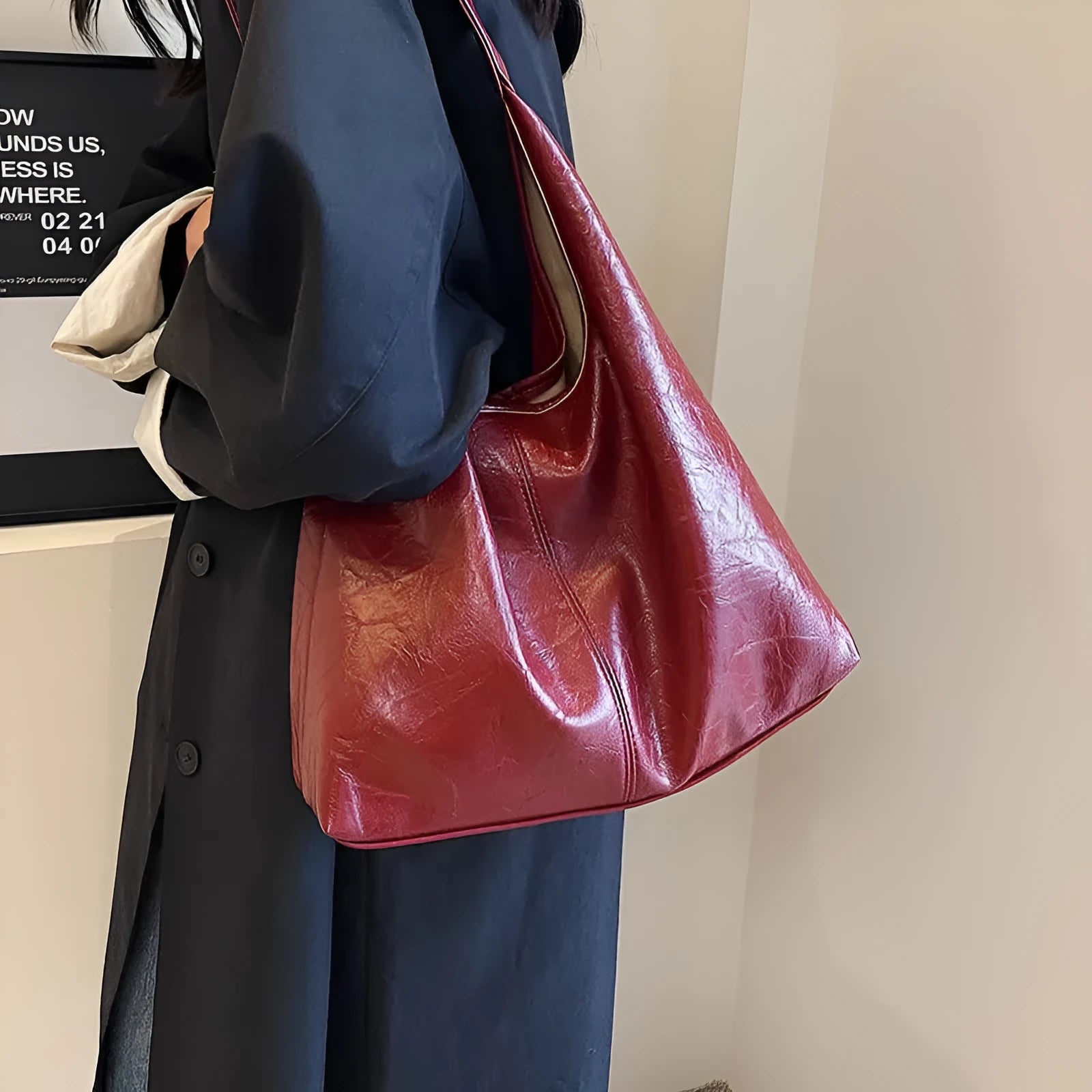 Soft PU leather shoulder bag with sewing thread accents and sandwich pocket design