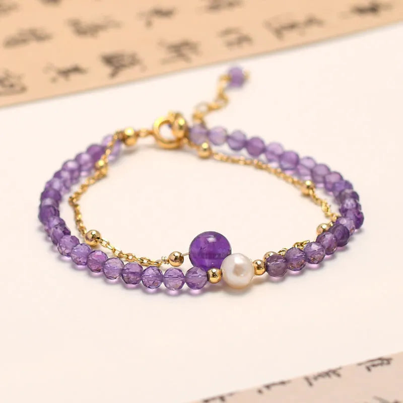 Chinese style women's bracelet with amethyst-coloured diamond-shaped crystals in electroplated metal setting