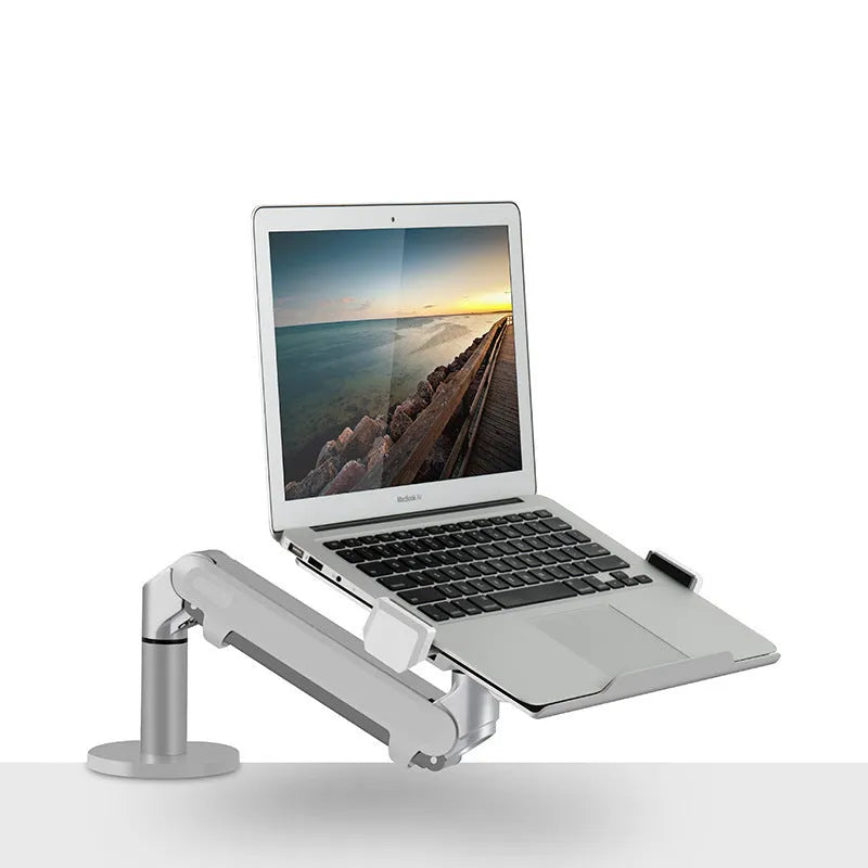 Silver aluminium laptop stand with adjustable air pressure arm on wooden desk
