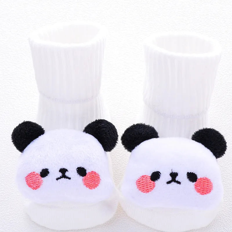Cotton baby socks in multiple colours and prints including panda, lion, bows, and stars on a white background.
