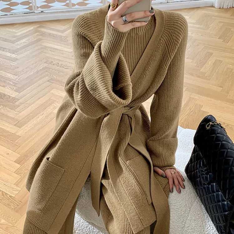 Women's apricot knitted three-piece set with cardigan, sweater and wide-leg trousers featuring leather stitching.