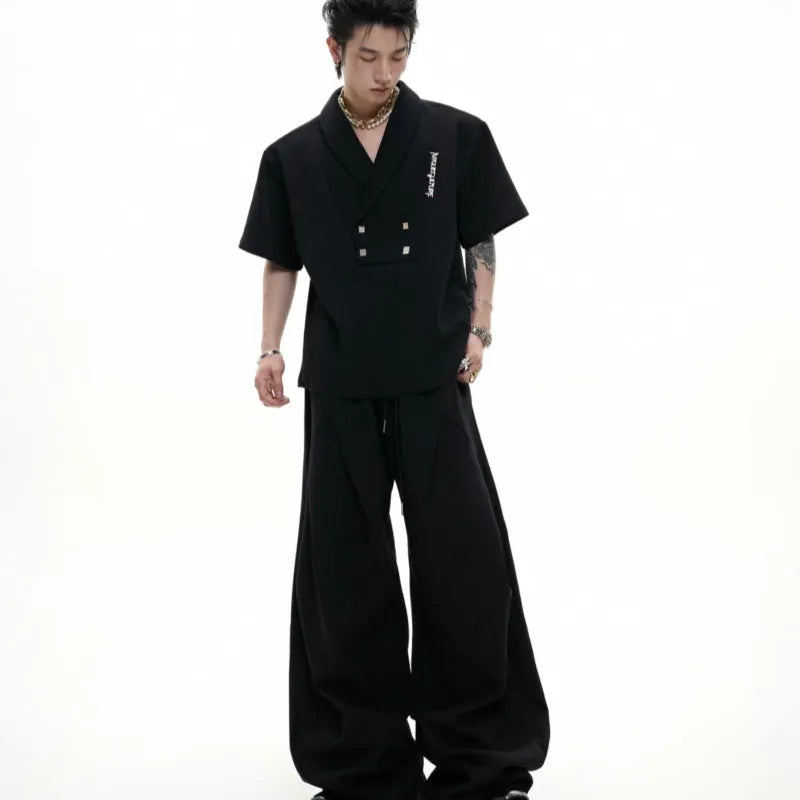 Men's dark cotton sports suit with padded shoulder V-neck top and matching shorts with metal embellishments