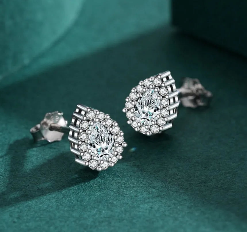 A pair of women's silver water drop shaped stud earrings made from 925 sterling silver.