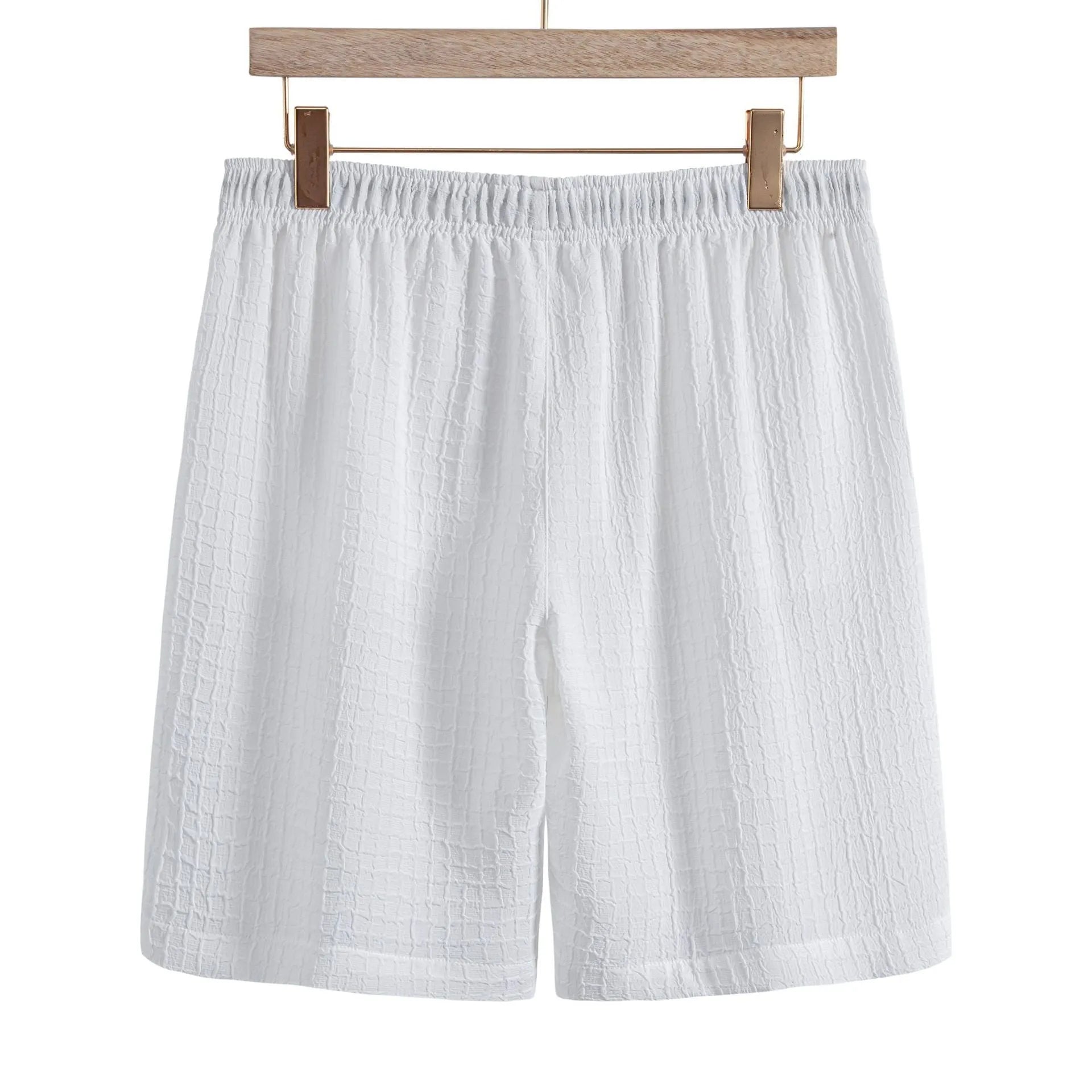 Men's white cotton blend jacquard short sleeve shirt and matching shorts laid flat