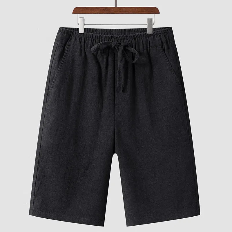 Men's loose-fit linen shorts in a cropped mid-length style with an elastic waistband.