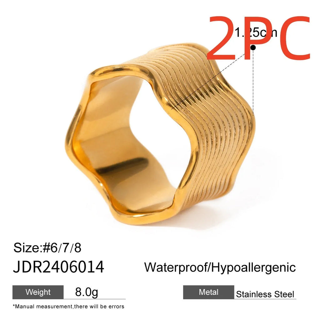 Geometric wide band stainless steel wave ring for women with electroplated finish.