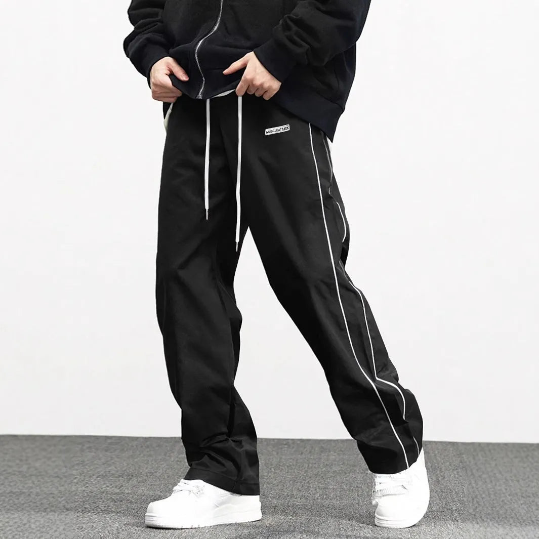 Men's loose fit polyester cargo trousers with side pockets in black, navy blue, and dark green