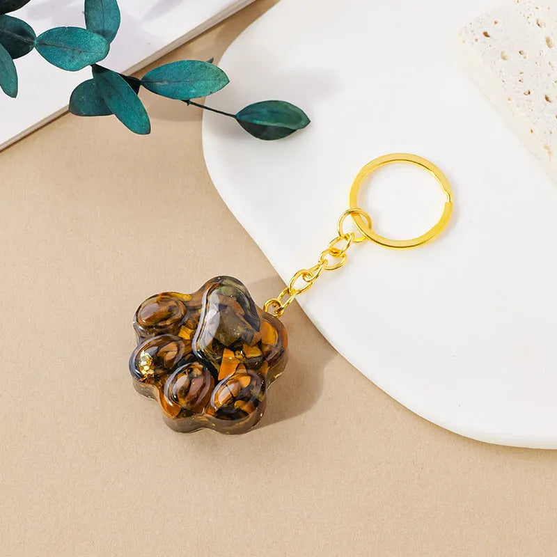 Small natural crystal cat's paw claw charm on a metal loop keychain