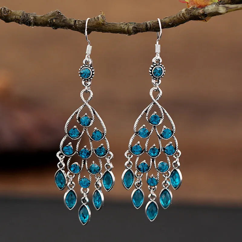 A pair of smart water drop purple retro long fringe drop earrings made from alloy metal.