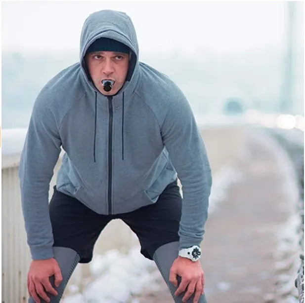 Breathing trainer respirator in white and black with silicone mouthpiece and adjustable resistance dial