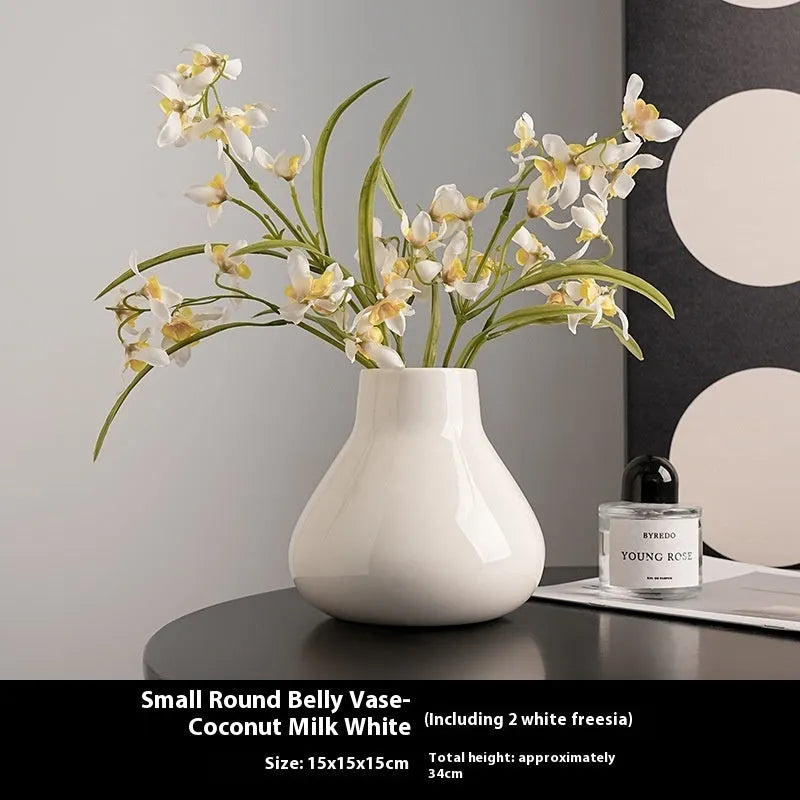 Ceramic decorative vase with artificial flowers in black or white modern design