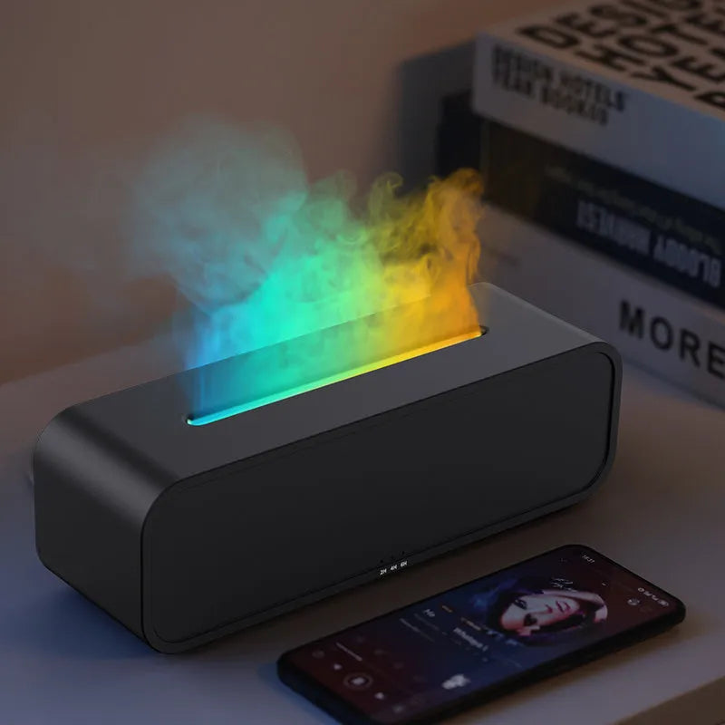 Black and white flame effect aroma diffuser with remote control on a table
