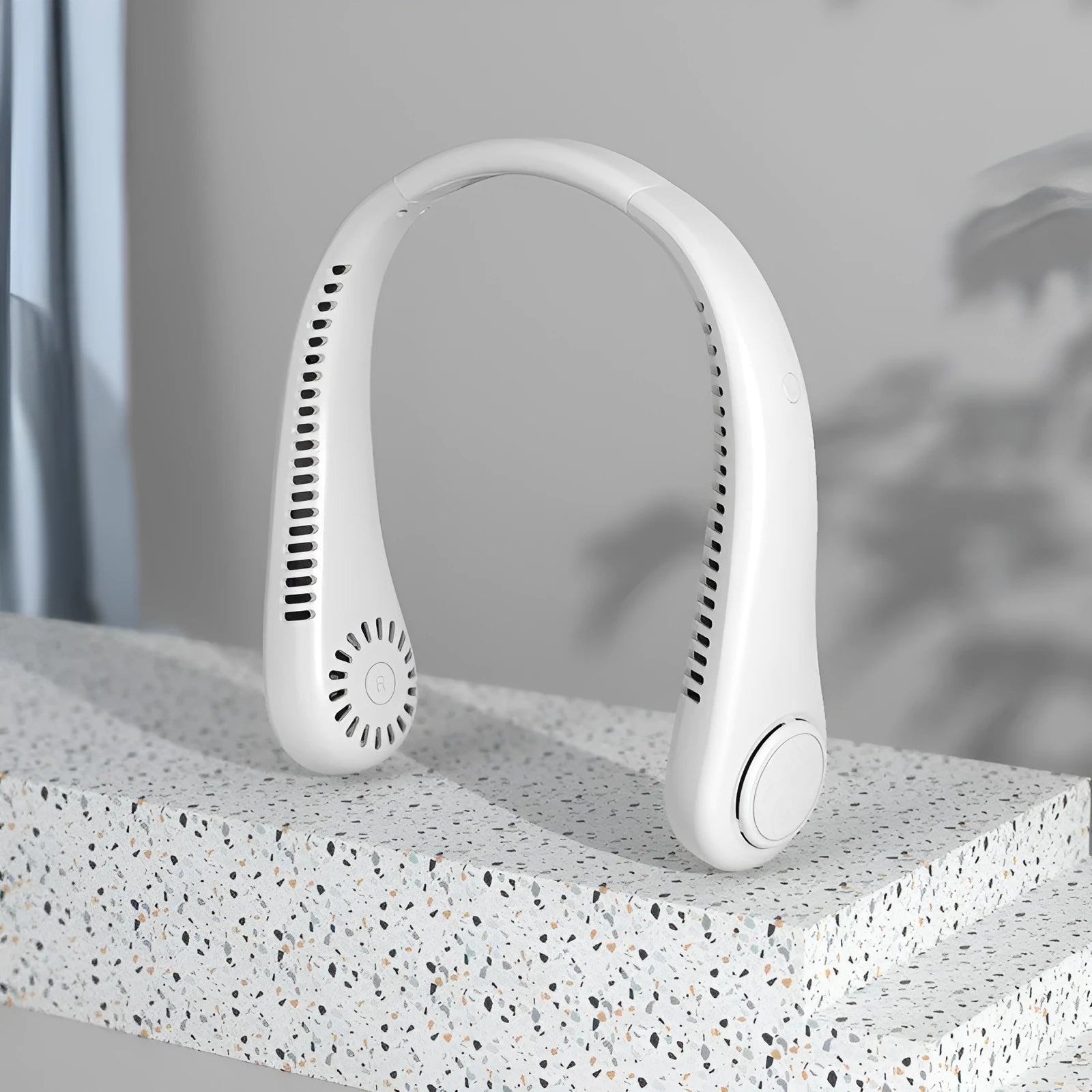 White USB rechargeable bladeless neck fan showing flexible neckband and adjustable controls