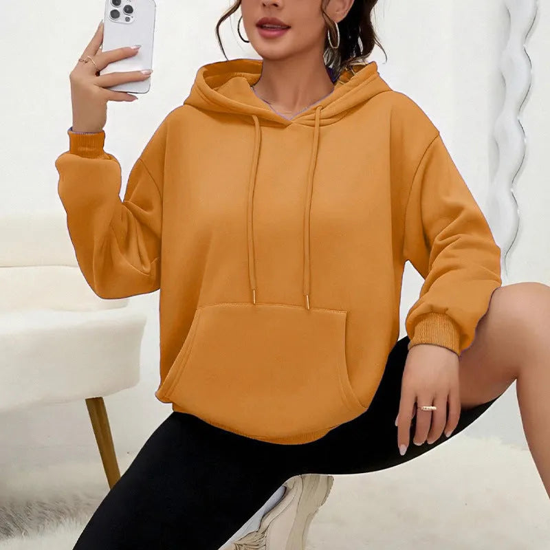 Women's loose drawstring pocket sweatshirt in various colours showing front pockets and adjustable collar