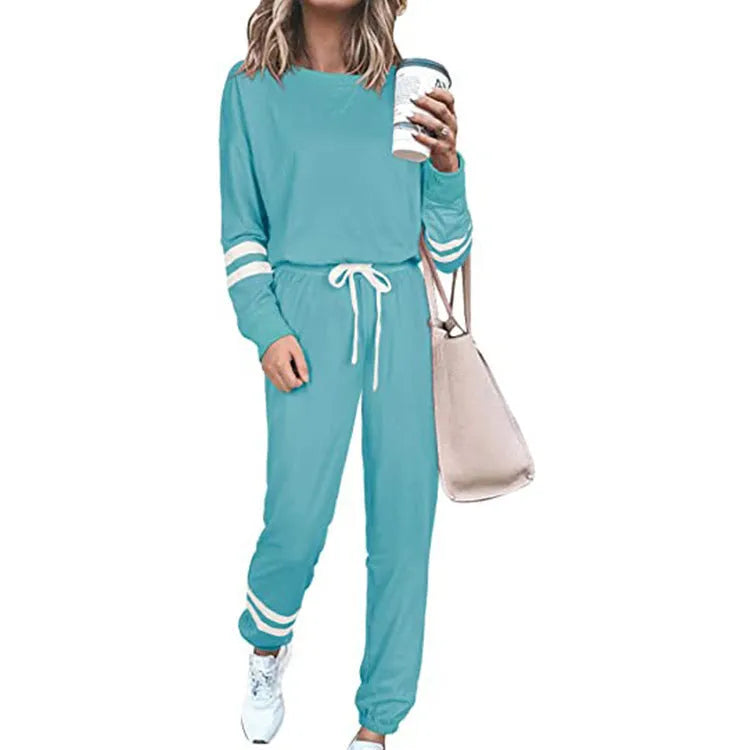 Women's plus size loose-fitting casual suit set in a solid colour, featuring a half-sleeve top and trousers.