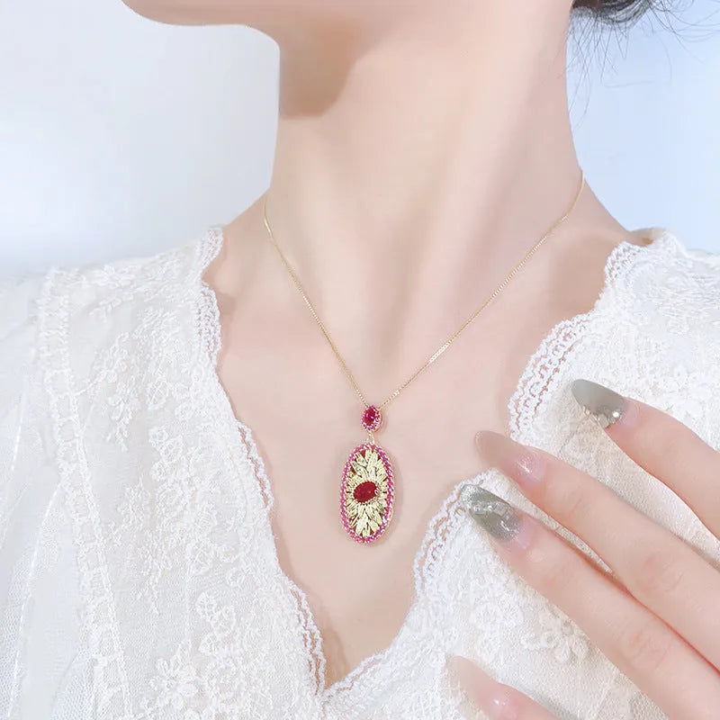 Gold-plated red corundum jewellery set showing necklace, ring and ear studs with diamond-cut water drop design
