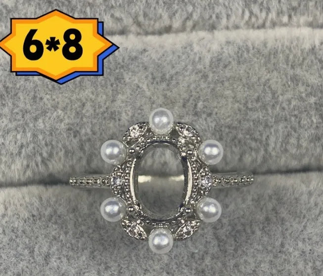 Oval denier open mouth ring with 6x8mm stone and five-pointed star on copper band.