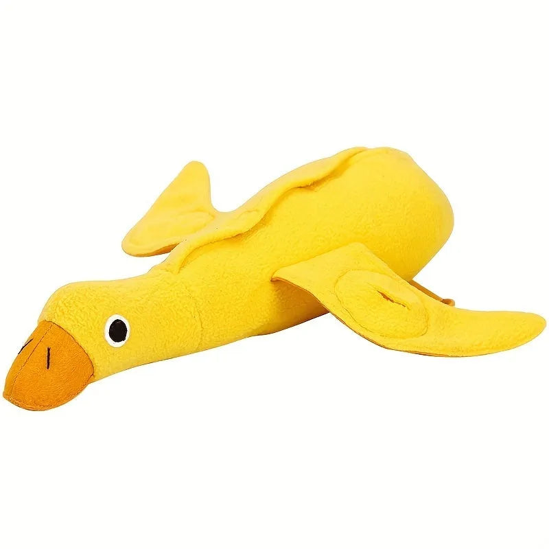 Yellow plush teddy dog toy with internal squeaky duck for training and food leak feature